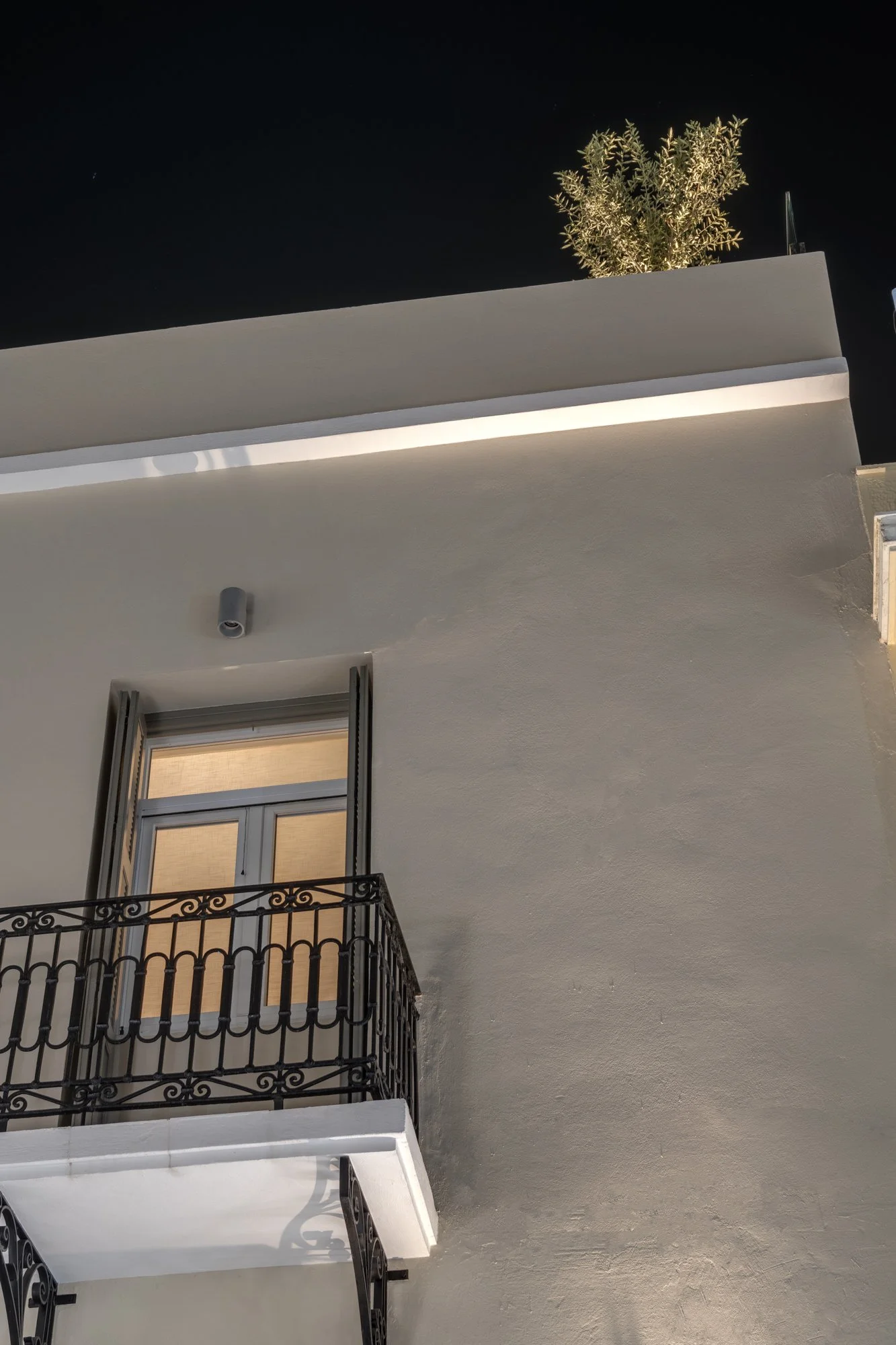 Front balcony and facade at night